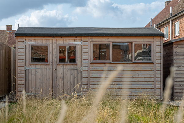 Superior Shed with heavy duty felt roof Timber garden workshop with double doors, several windows and a dark felt roof.